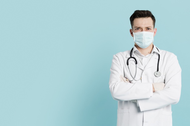 front-view-doctor-with-medical-mask-posing-with-crossed-arms_23-2148445082