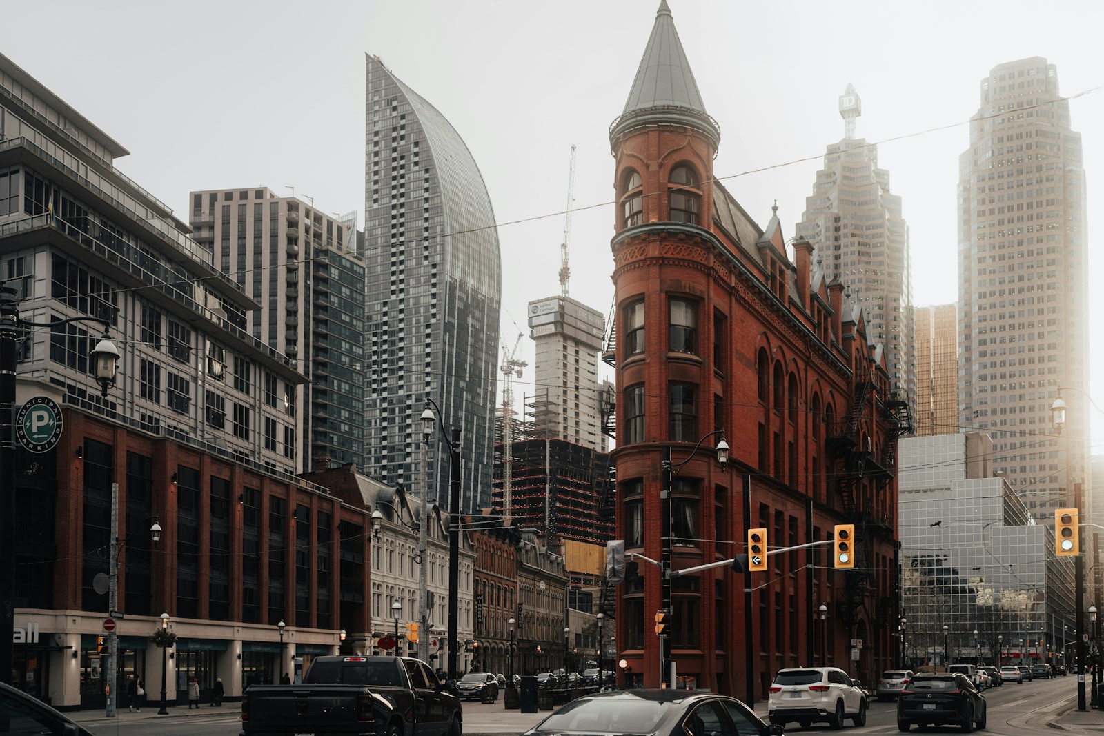 a city street filled with traffic and tall buildings